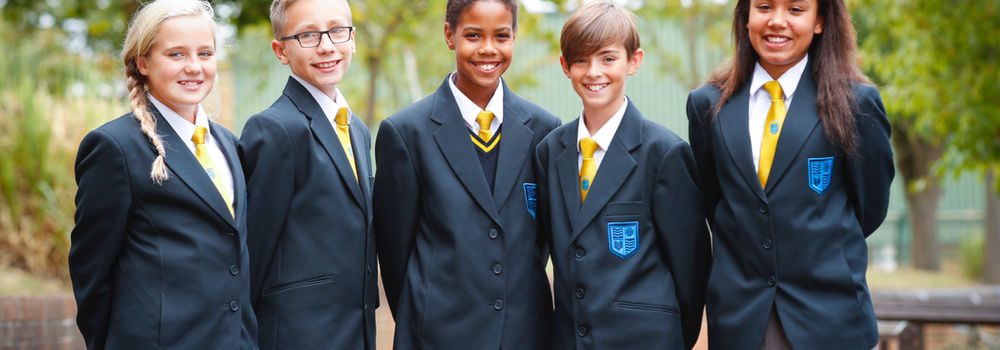 A group of students dressed in a smart school uniform