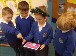 Students looking at a story book in a classroom