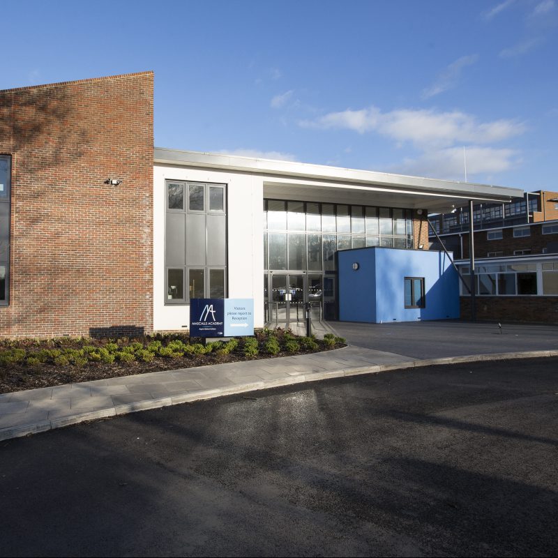 External photo of the main entrance of the Mascalls Academy building.