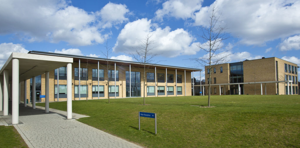 Exterior photo of the main building on the Stationers' Crown Woods Academy grounds.