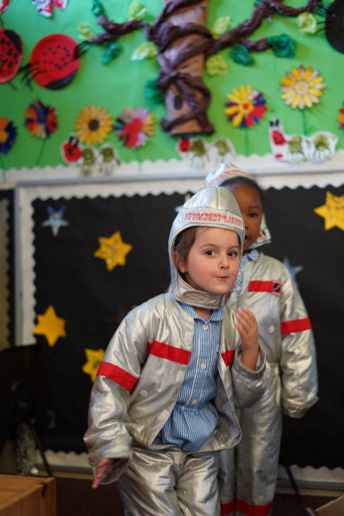 A young student dressed up as an astronaut