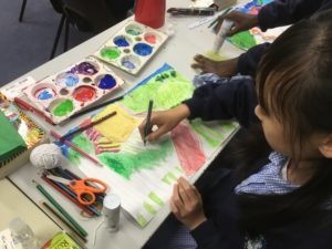 A child creating their artwork