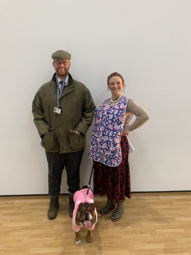 Two staff members and a dog dressed up for World Book day from LAR