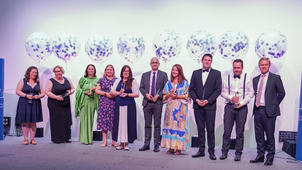 Photo of award winners holding their trophies alongside Chief Executive Simon Beamish at the LAT Awards Ceremony 2022.