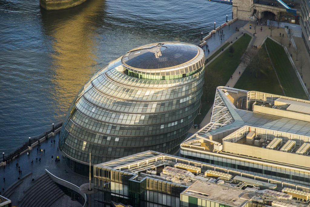 Aerial view photo taken of London's City Hall building.