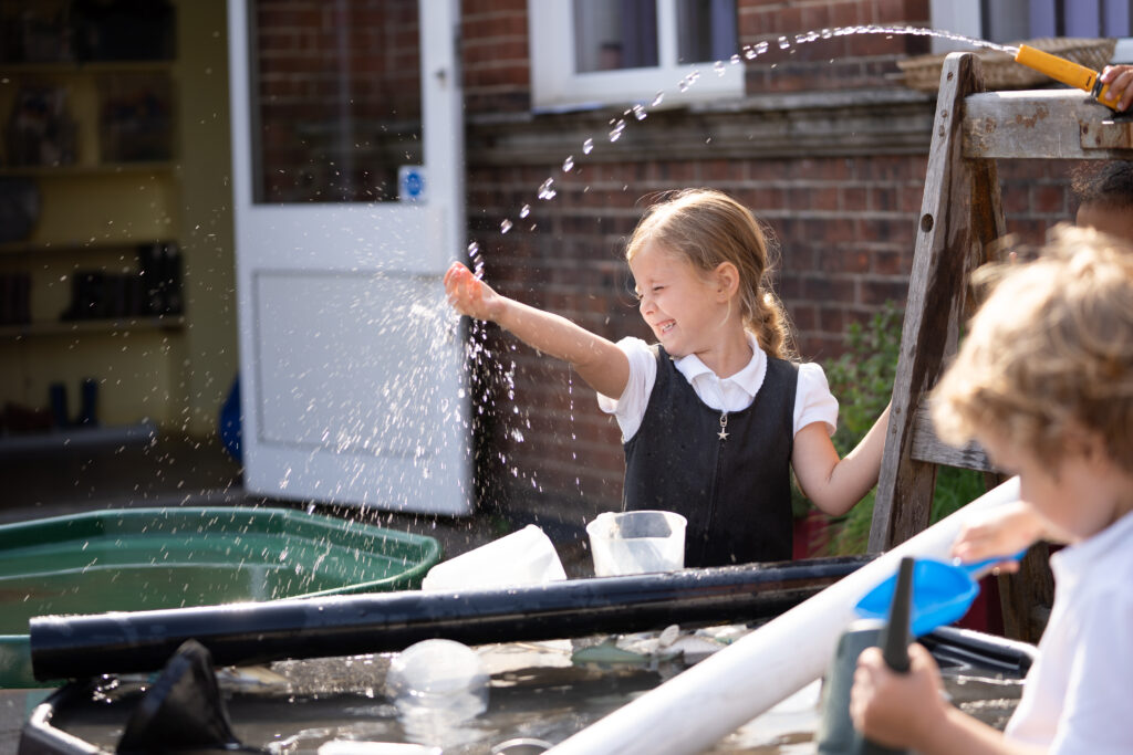 A school student playing with water
