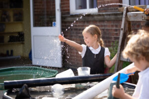 A school student playing with water