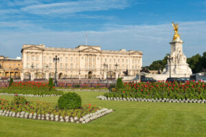 London, England, UK - 20th June 2015: Wide angle view of Buckingham Palace illuminated in early morning sunlight.